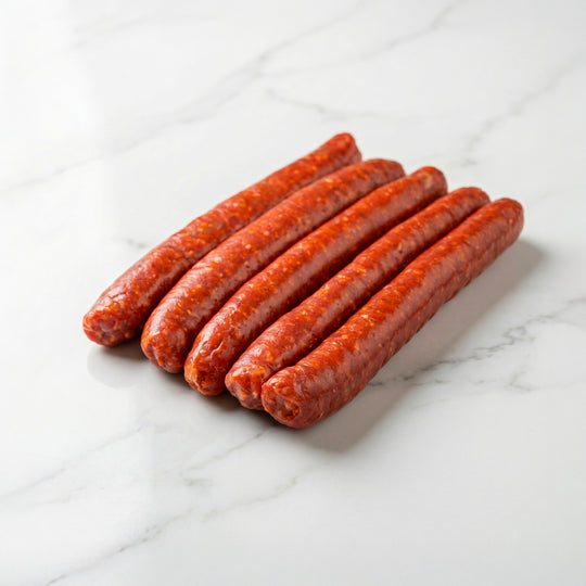 Merguez artisanales crues de bœuf et d'agneau préparées en atelier par La Boucherie s.a.